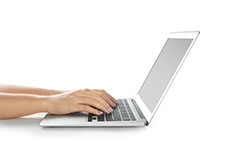 Two hands typing on a laptop with Hach eLearning and expert training